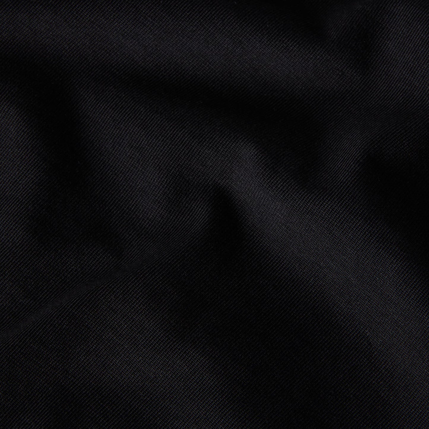 T-Shirt de manga curta para homem The North Face Liquid Box NSE Oversize em Preto TNF. Foto de detalhe do tecido.