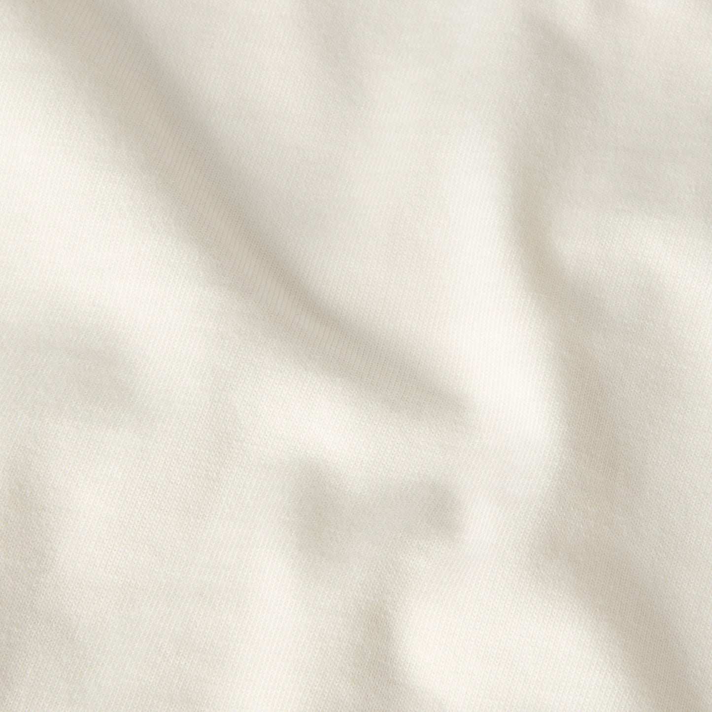 T-Shirt de manga curta unissexo The North Face TNF Snack Relaxed Graphic em Branco Dune. Foto de detalhe do material.
