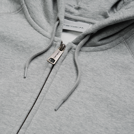 Carhartt WIP Hooded Chase Jacket Grey Heather/Gold. Foto de detalhe do fecho.