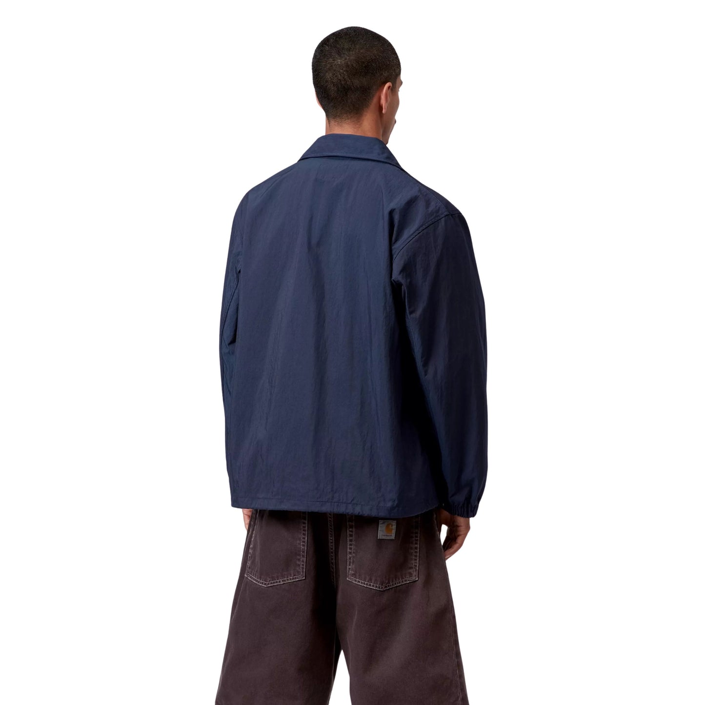 Casaco Coach para homem Carhartt WIP Eightynine em Jupiter/Branco. Foto da parte de trás, vestido.