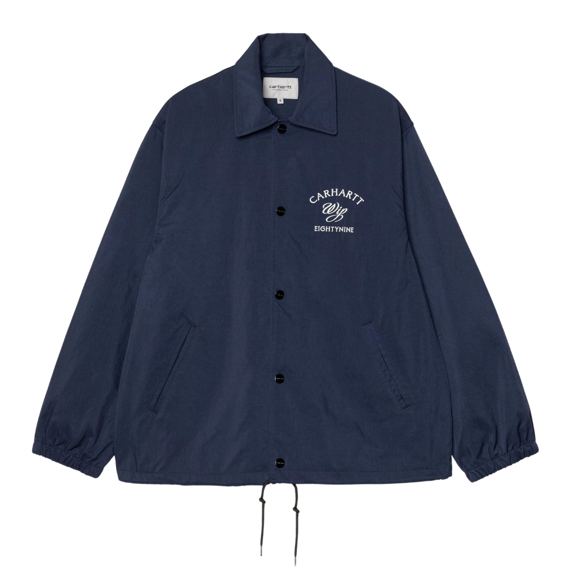 Casaco Coach para homem Carhartt WIP Eightynine em Jupiter/Branco. Foto da parte da frente.