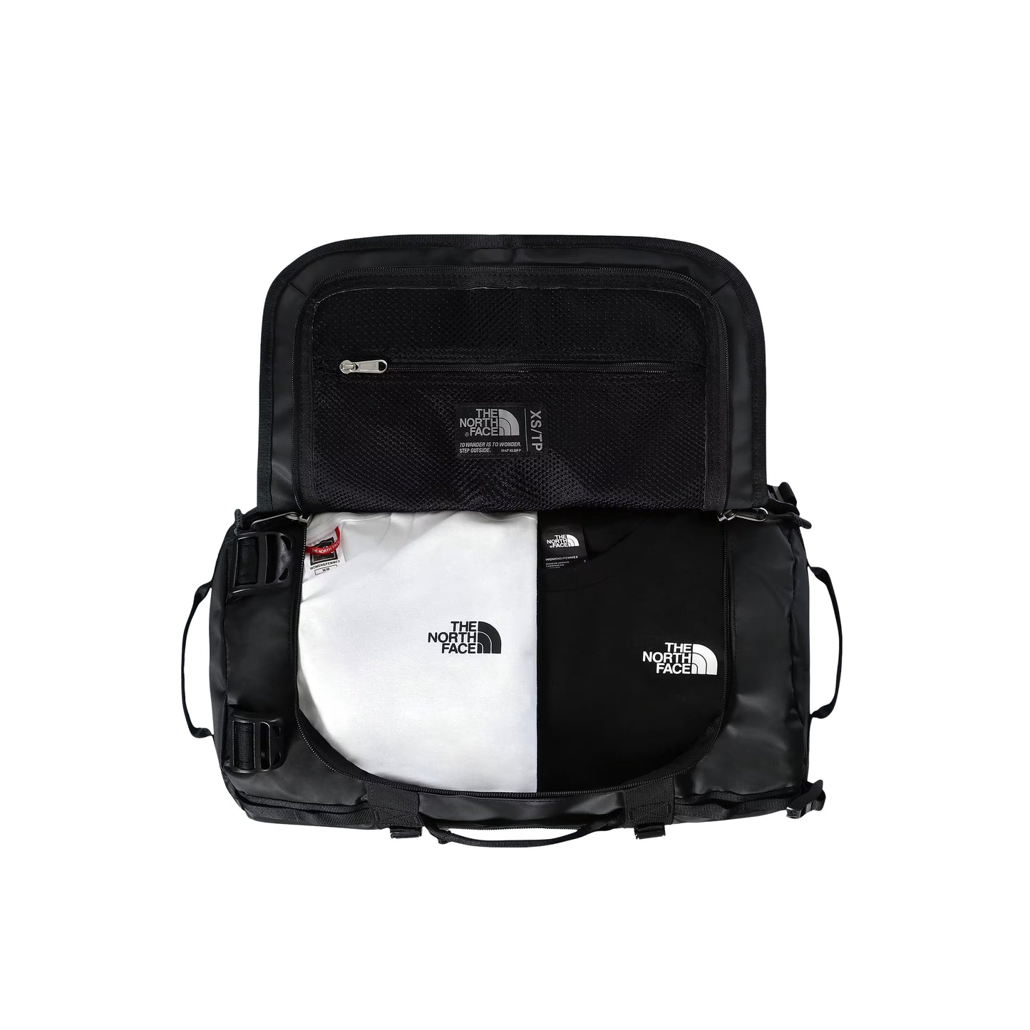 Saco de viagem The North Face Base Camp Duffel XS em TNF Black — interior aberto visto de cima, compartimento principal com dois sacos TNF dobrados em branco e preto, tampa interior com bolso de malha e zip prateado e etiqueta TNF XS/TP visíveis, fundo branco.