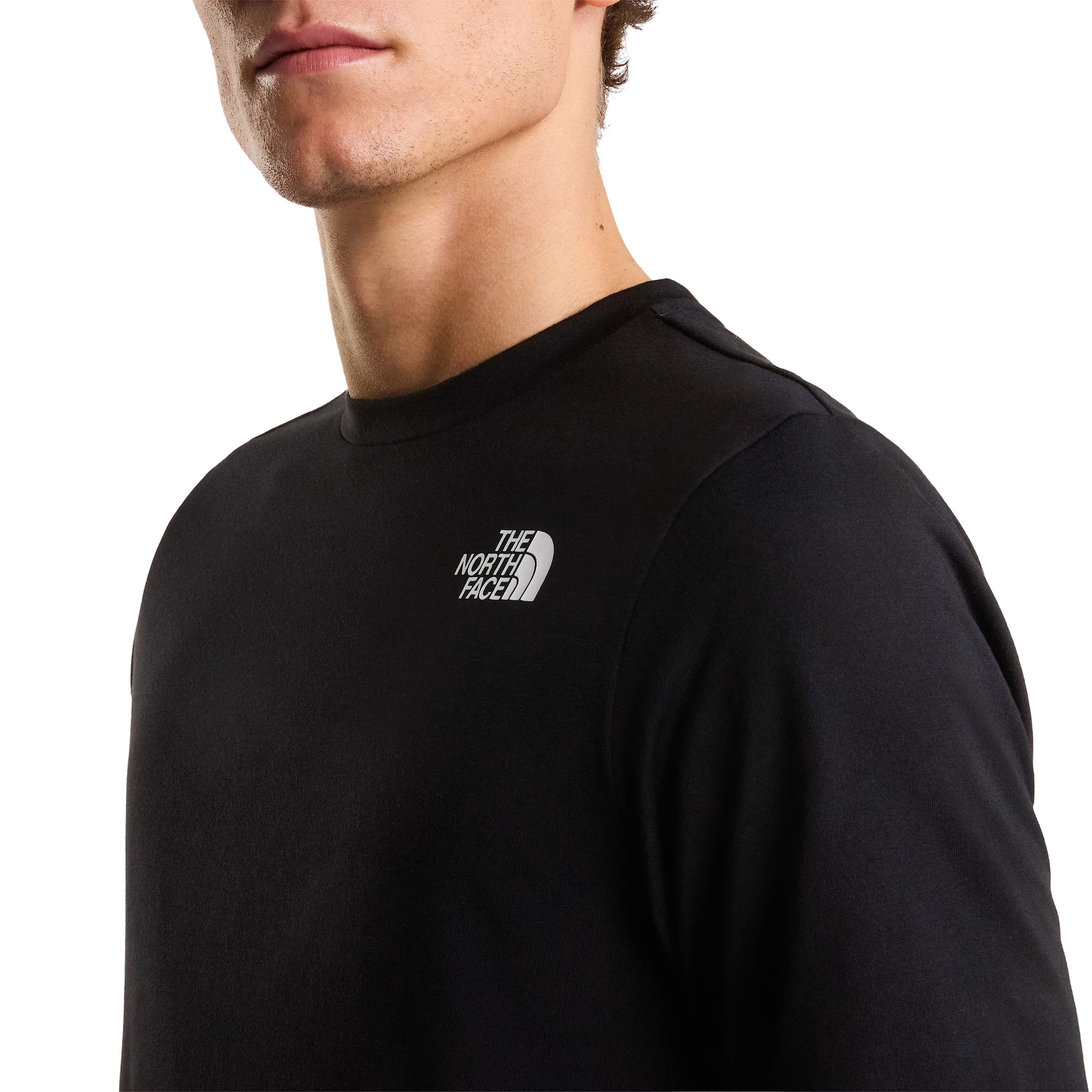 T-Shirt de manga curta para homem The North Face Bitmap Logo Graphic em Preto TNF. Foto de detalhe da parte da frente, vestida.