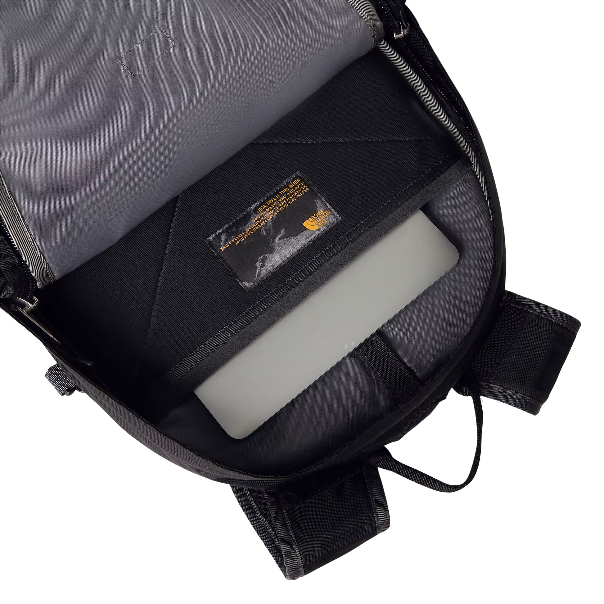 Mochila The North Face Borealis Classic em TNF Black / Asphalt Grey — interior do compartimento principal aberto, bolso acolchoado para laptop em Asphalt Grey com laptop cinzento inserido, etiqueta TNF dourada e alças FlexVent visíveis.