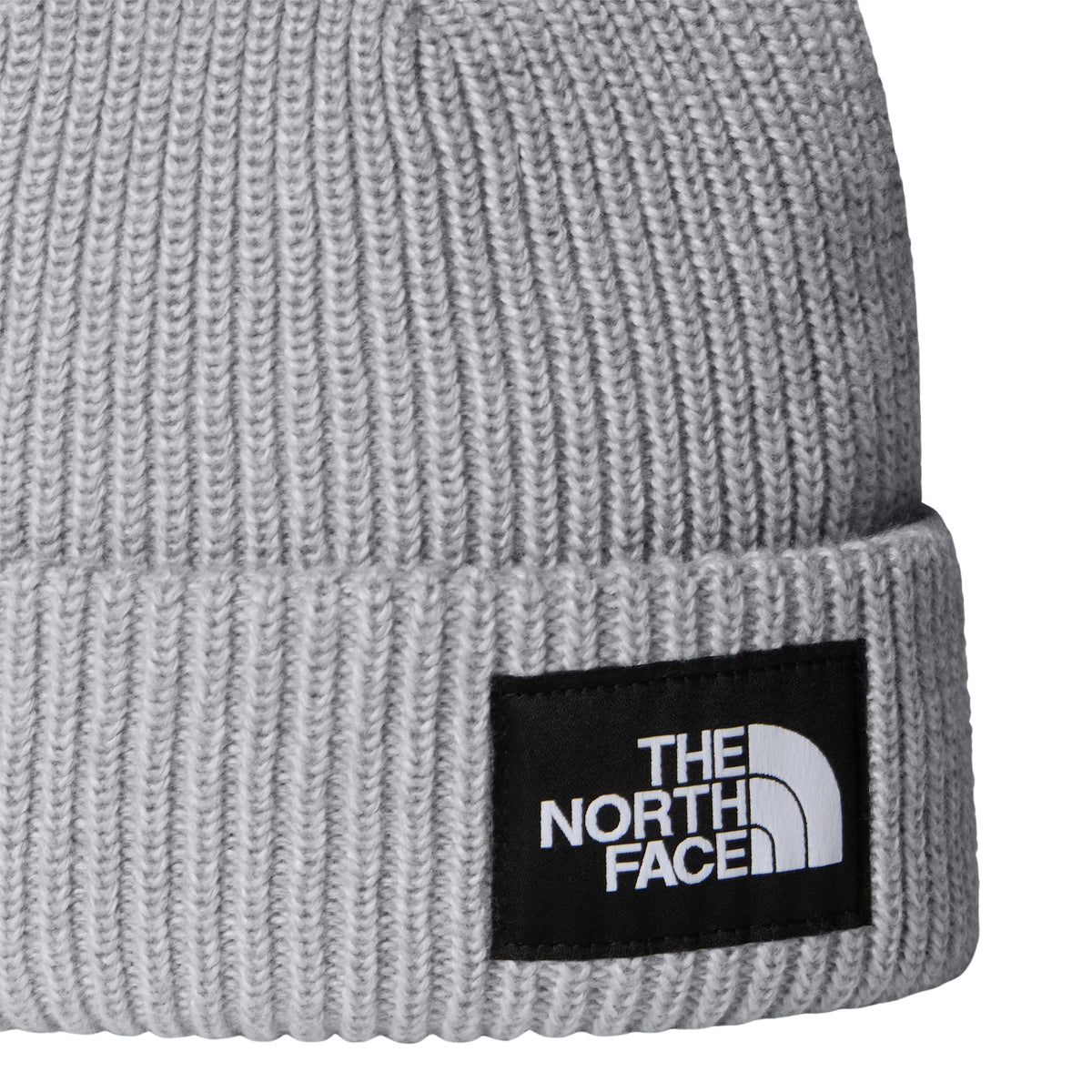 Pormenor da malha cinzento-claro mesclada e da etiqueta com logótipo na dobra do gorro The North Face Salty Lined.