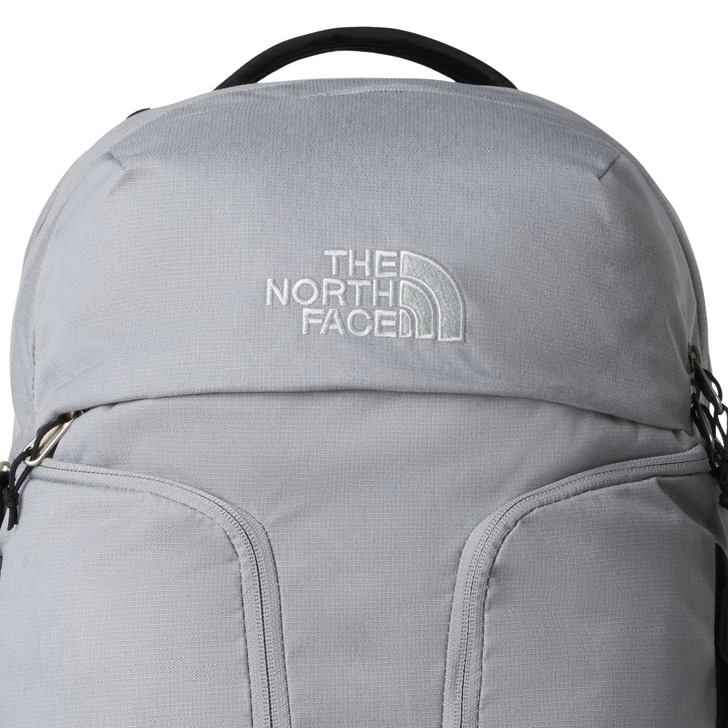 Mochila unissexo The North Face Surge em Cinza Escuro Heather Meld/Preto TNF. Foto de detalhe da parte da frente.
