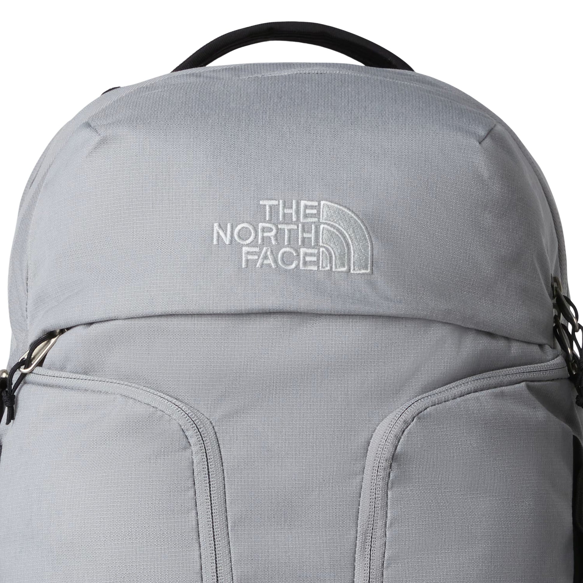 Mochila unissexo The North Face Surge em Cinza Escuro Heather Meld/Preto TNF. Foto de detalhe da parte da frente.