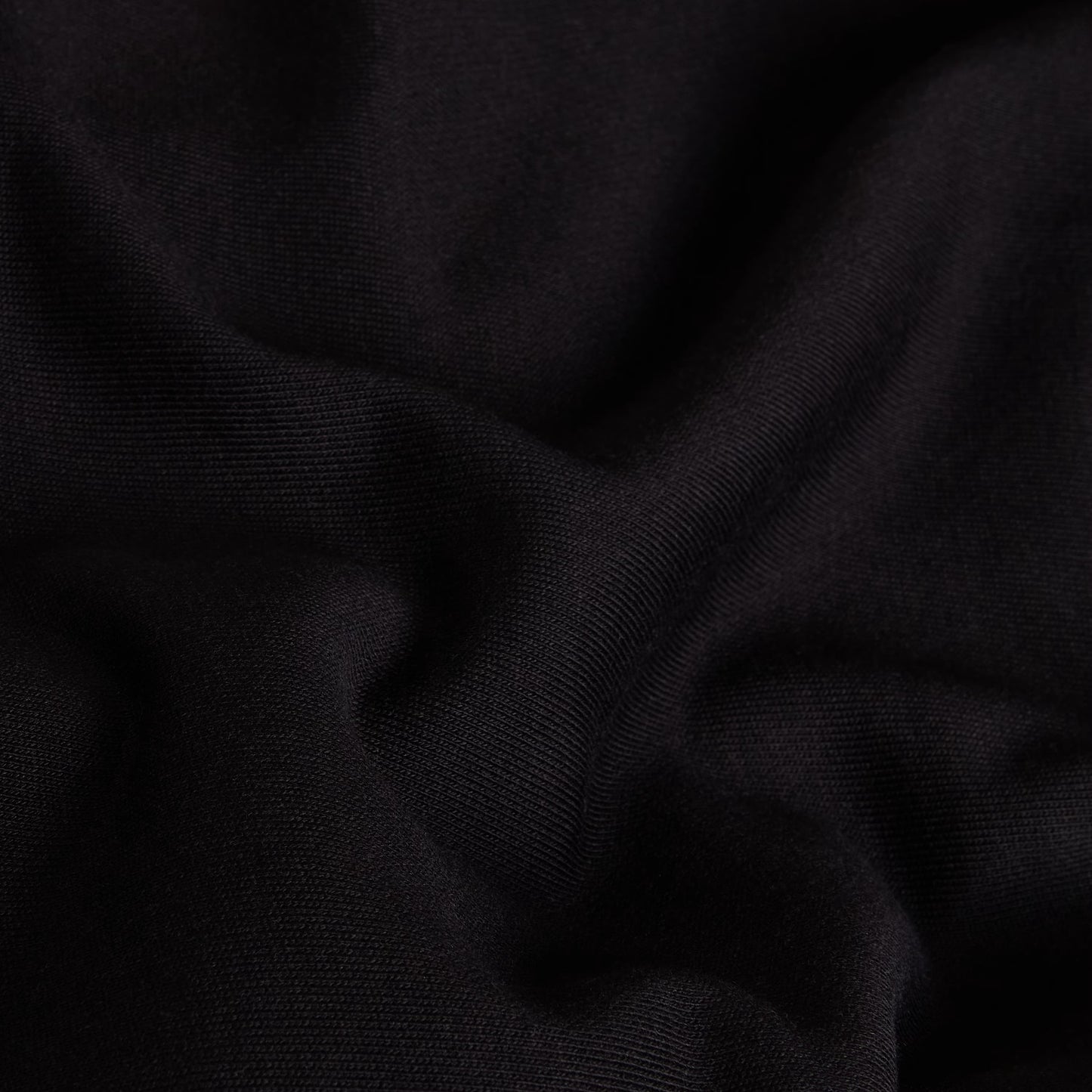 Hoodie The North Face TNF Essential Simple Dome Relaxed Full Zip em TNF Black — vista lateral direita, produto sem modelo, capuz com pregas e cordão branco, corte relaxado com manga larga, punho canelado e bainha canelada em malha cardada preta visíveis, fundo branco.