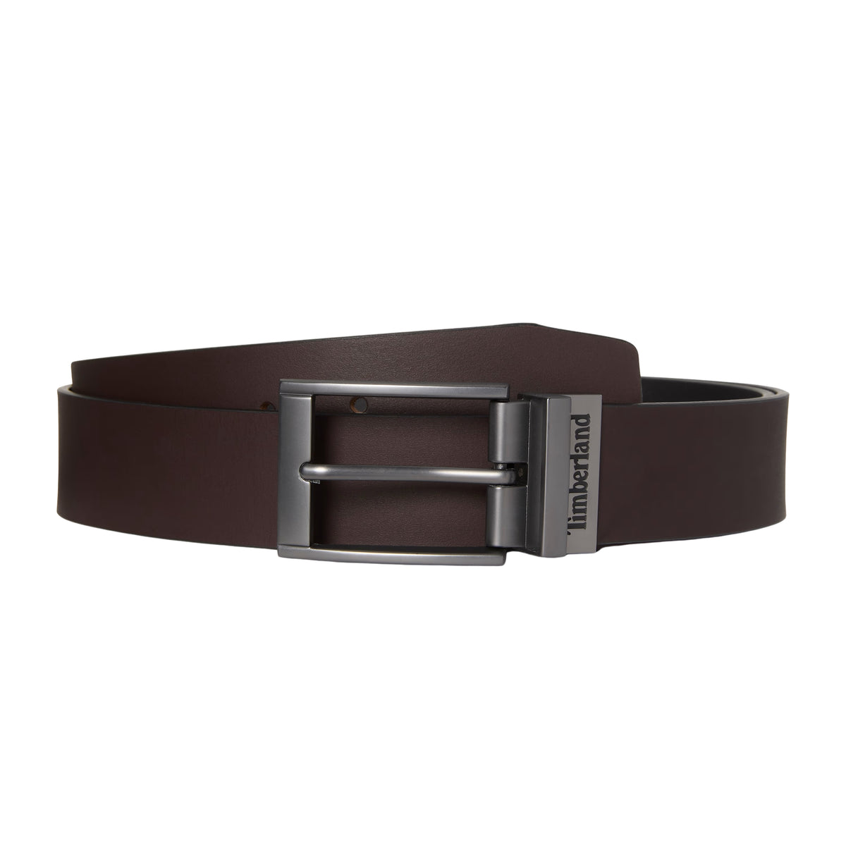 Cinto reversível Timberland Bartley para homem em Castanho/Preto — produto sem modelo enrolado, pele castanha lisa com fivela reversível em cinza fosco e presilha com logo Timberland gravado, fundo branco.